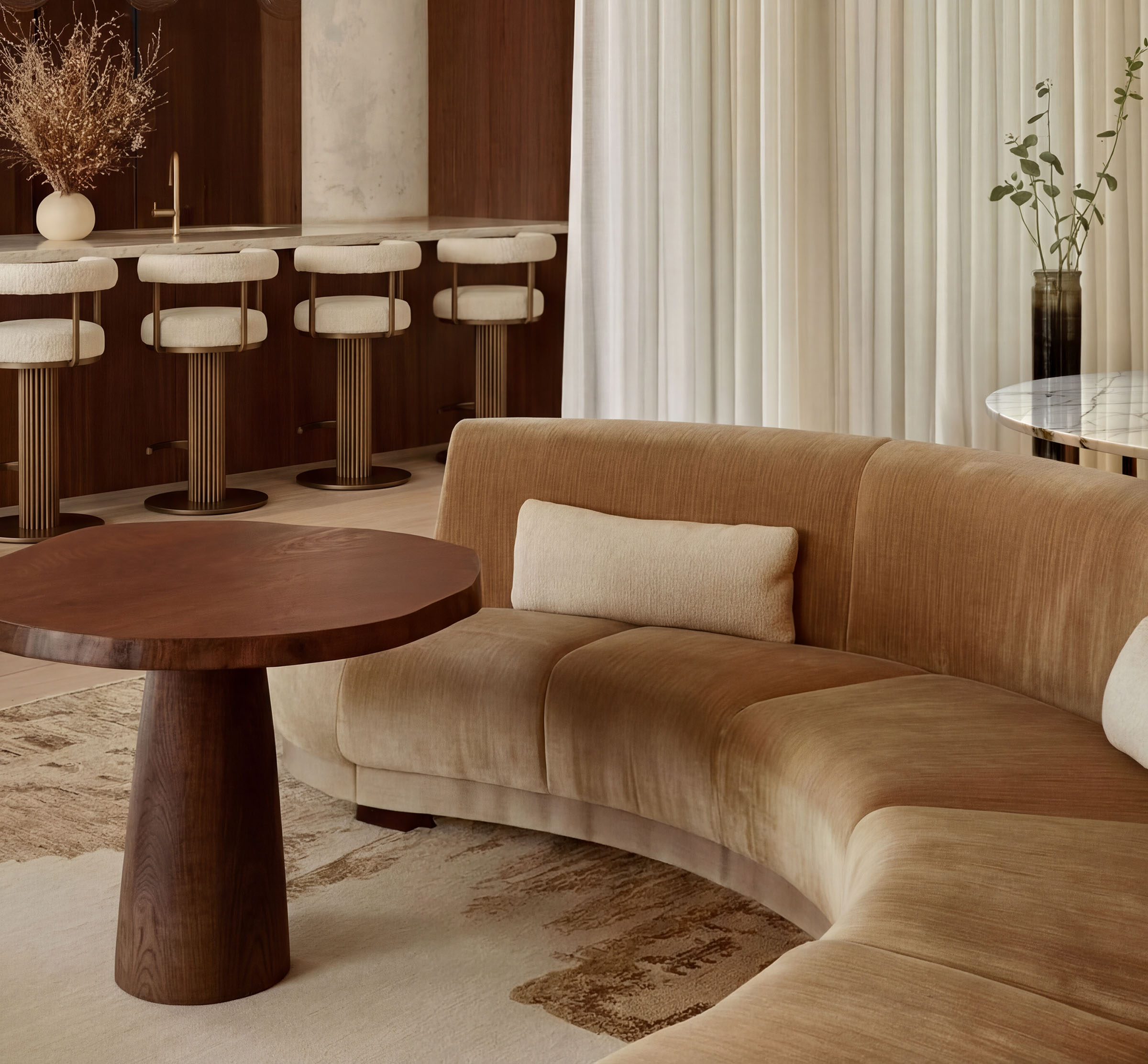 BTR lounge interior with curved sofa, walnut bar and sheer curtains — build-to-rent design by Ademchic