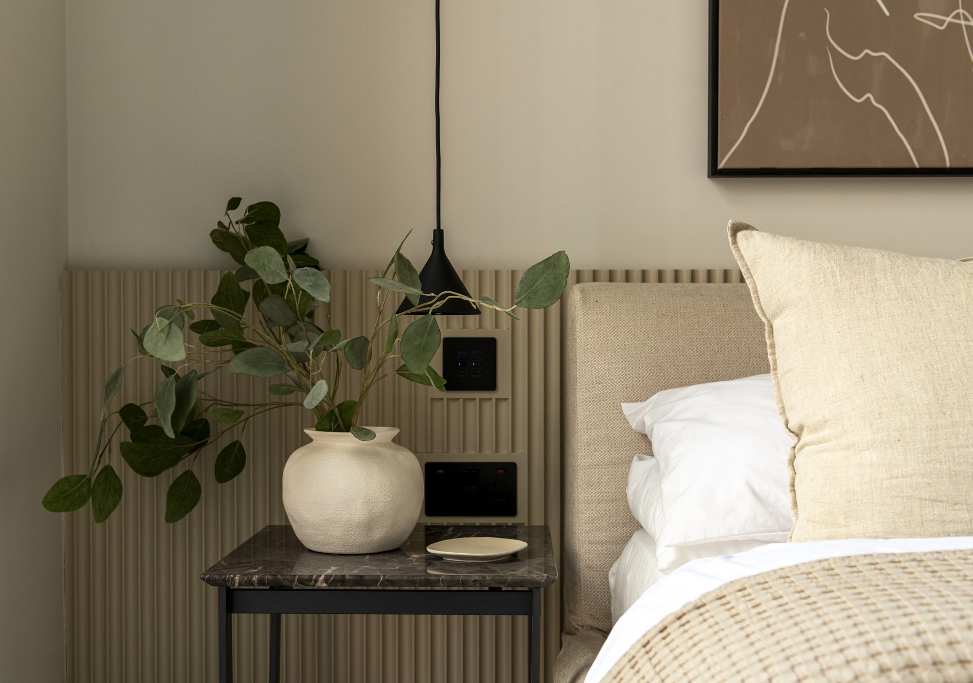 Ivy Gardens bedroom detail — pendant light, marble side table and layered lighting design