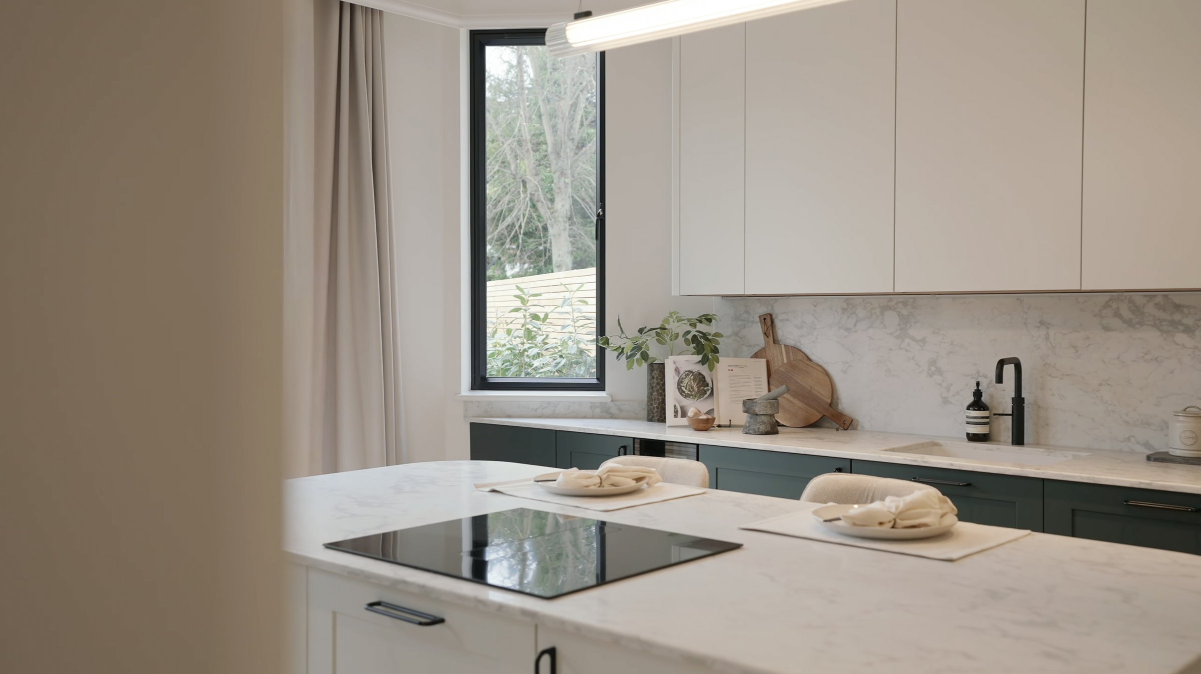 Montpelier-Mews-kitchen with marble splashback and green cabinets — interior design by Ademchic
